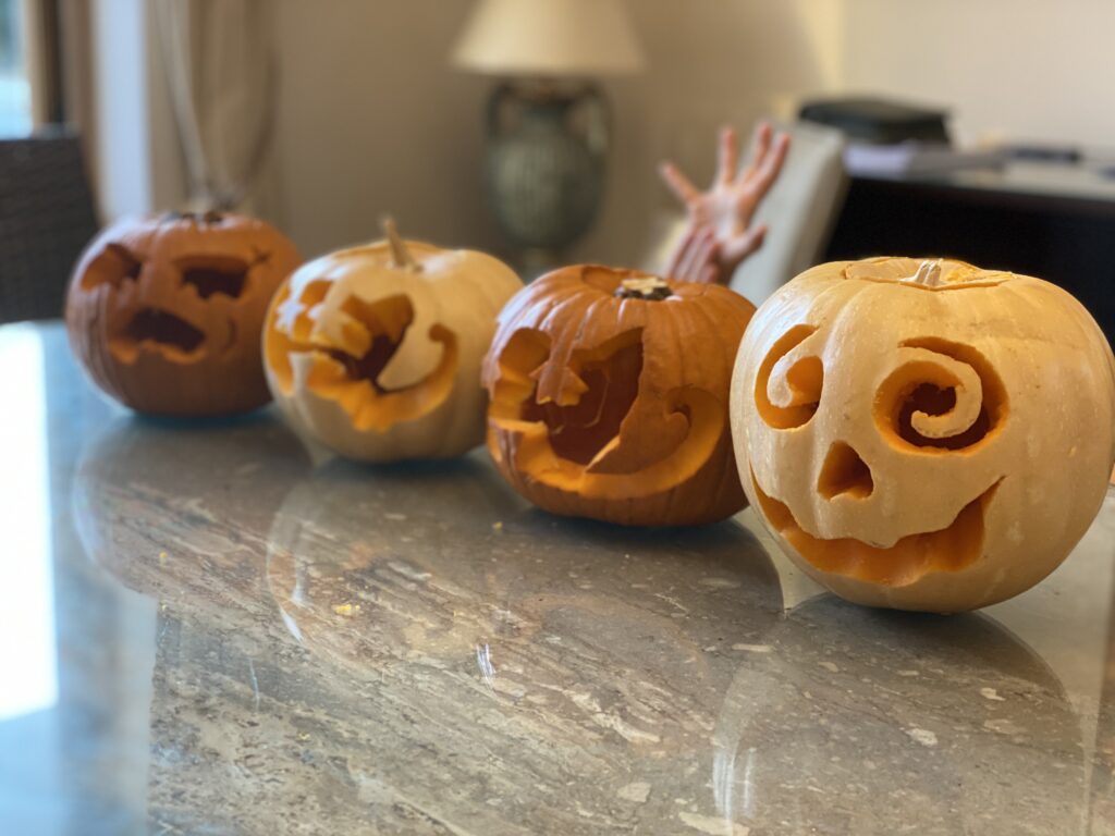 Four carved pumpkin designs.